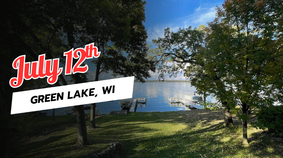 Daniel Van Kirk Green Lake 2025 View through trees onto a lake with small piers.