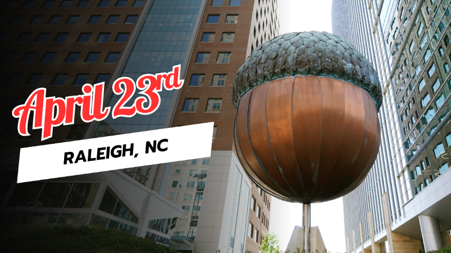 A large acorn sculpture in a city.