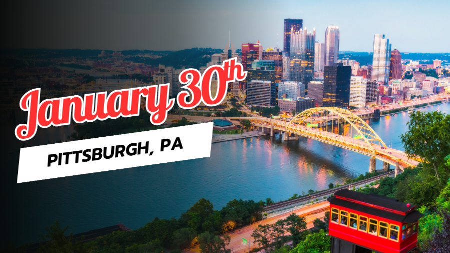 Pittsburgh skyline including a river and bridge.